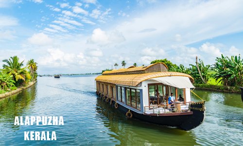 A houseboat on a river under a white and blue sky.